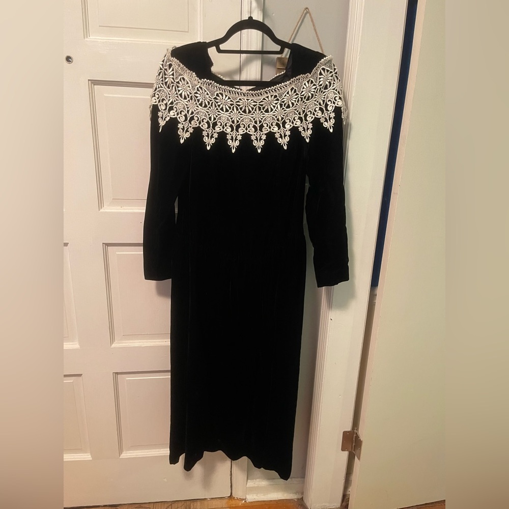 This a a gorgeous dark burgundy velvet dress with lace.
